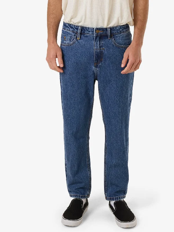 Men's Distressed Jeans with Patches for a Retro and DIY - Inspired AppearanceChopped Denim Jean - Double Rinsed Blues Men's Distressed Jeans with Patches for a Retro and DIY - Inspired AppearanceChopped Denim Jean - Double Rinsed Blues