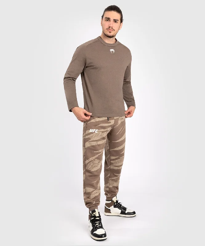 Men's button - front t - shirts with a unique artistic printUFC Adrenaline by Venum Fight Week Men’s Long Sleeve T-Shirt - Bronze Men's button - front t - shirts with a unique artistic printUFC Adrenaline by Venum Fight Week Men’s Long Sleeve T-Shirt - Bronze