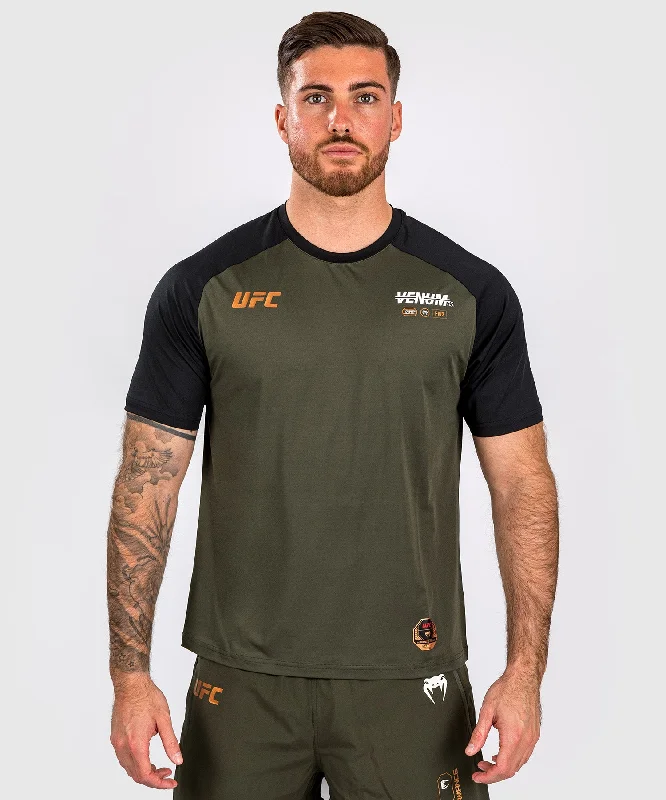 Men's eco - friendly recycled t - shirts for sustainable fashion choicesUFC Adrenaline by Venum Fight Week Men’s Dry-tech T-shirt - Khaki/Bronze Men's eco - friendly recycled t - shirts for sustainable fashion choicesUFC Adrenaline by Venum Fight Week Men’s Dry-tech T-shirt - Khaki/Bronze